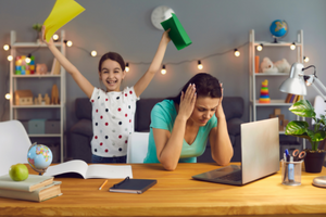 Stressed parent working at home