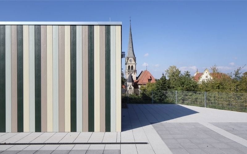 colourful exterior cladding on the right church and blue sky