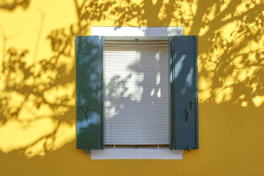 Close your house as much as possible when the sun is out. Close shutters, curtains and doors, and open them again for fresh air when it has cooled down.