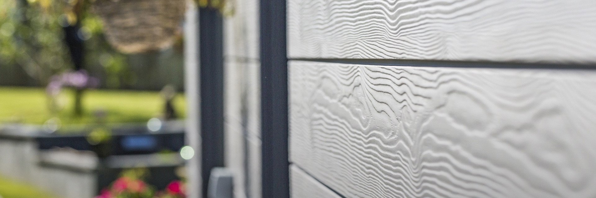 Close-up of Cedral Click Textured fibre cement siding in C05, showing contemporary timber-like finish on home exterior.