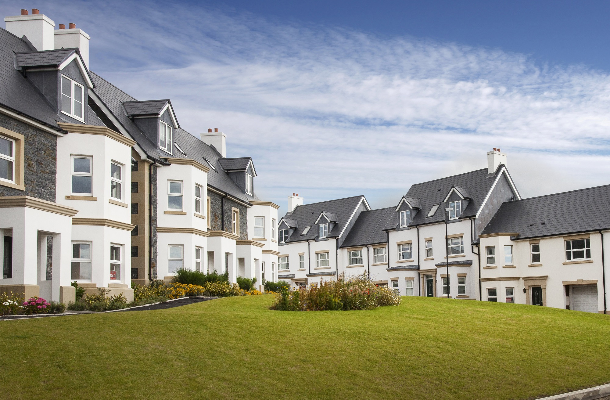 Cedral fibre cement roofing slates on modern Canadian homes, offering durability, charm, and weather resistance for all seasons.