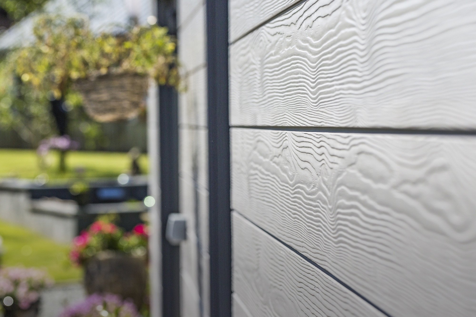 Platinum Grey C05 fibre cement facade cladding by Cedral featuring wood-effect texture