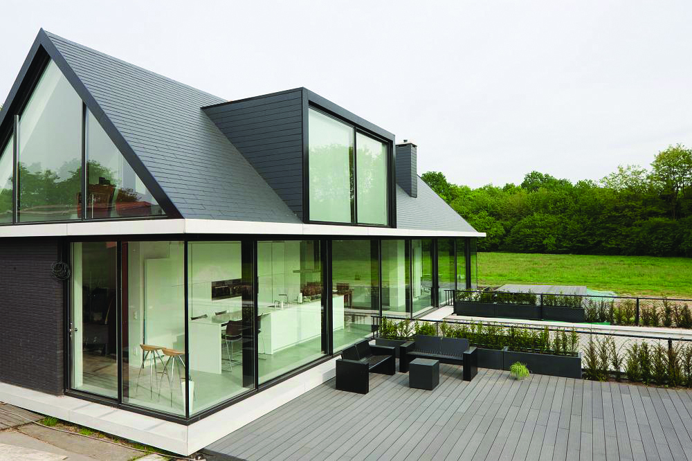 Šīferis jūsu mājai: 5 moderni jumti un fasādes